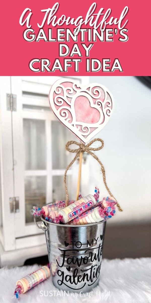 Bucket with lettering filled with candy and a wooden heart with text overlay.