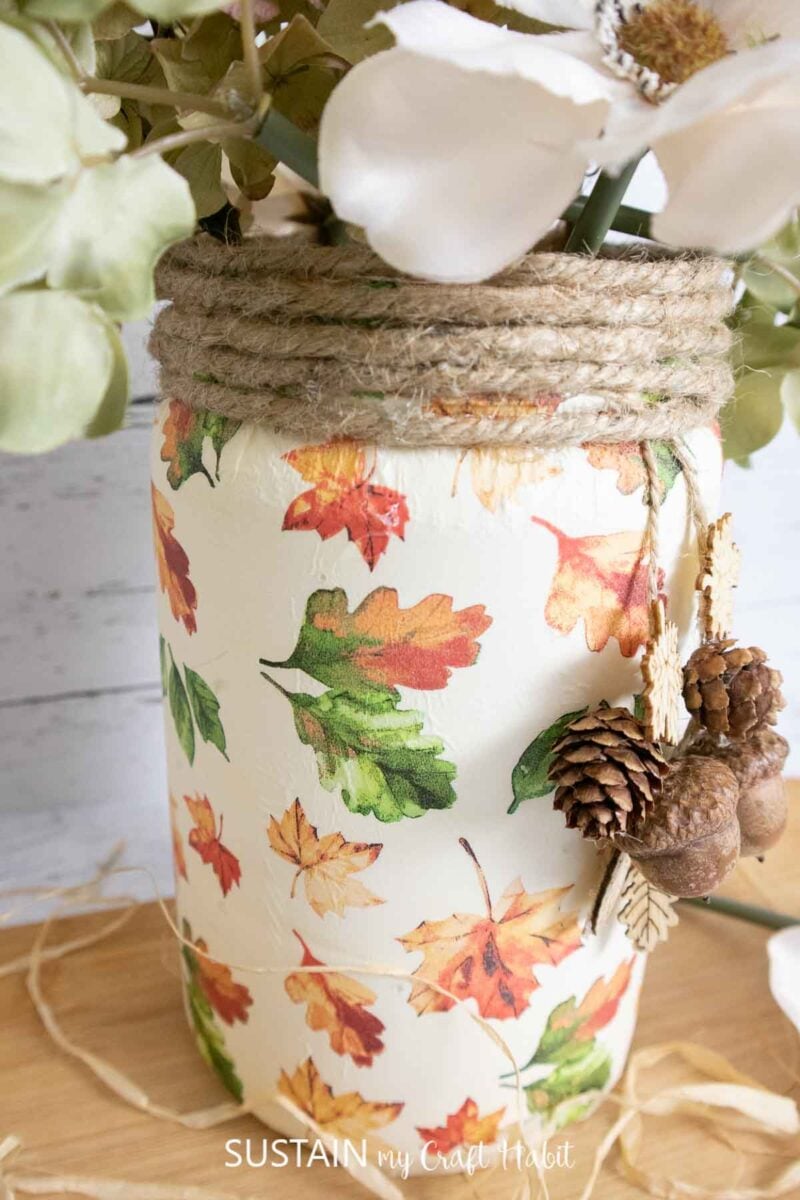 Mod podge on plastic made into a fall leaf luminary with dried flowers and embellishments. 
