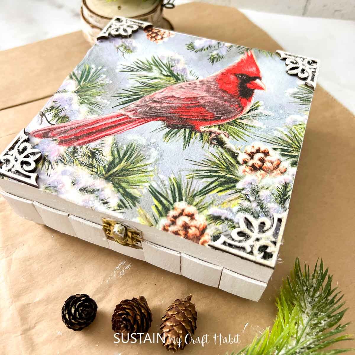 Keepsake box decorated with paint, embellishments and decoupage Christmas paper napkins.