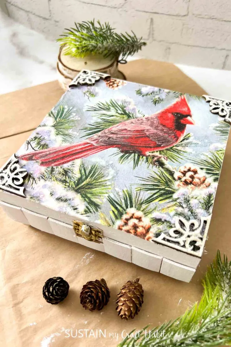 Keepsake box decorated with paint, embellishments and decoupage Christmas paper napkins.