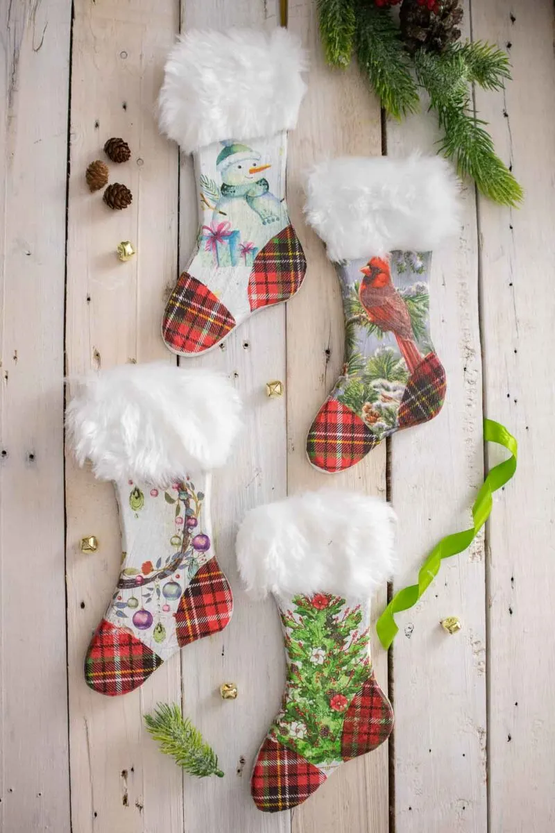 Wooden Christmas stockings decorated with festive napkins and faux fur.