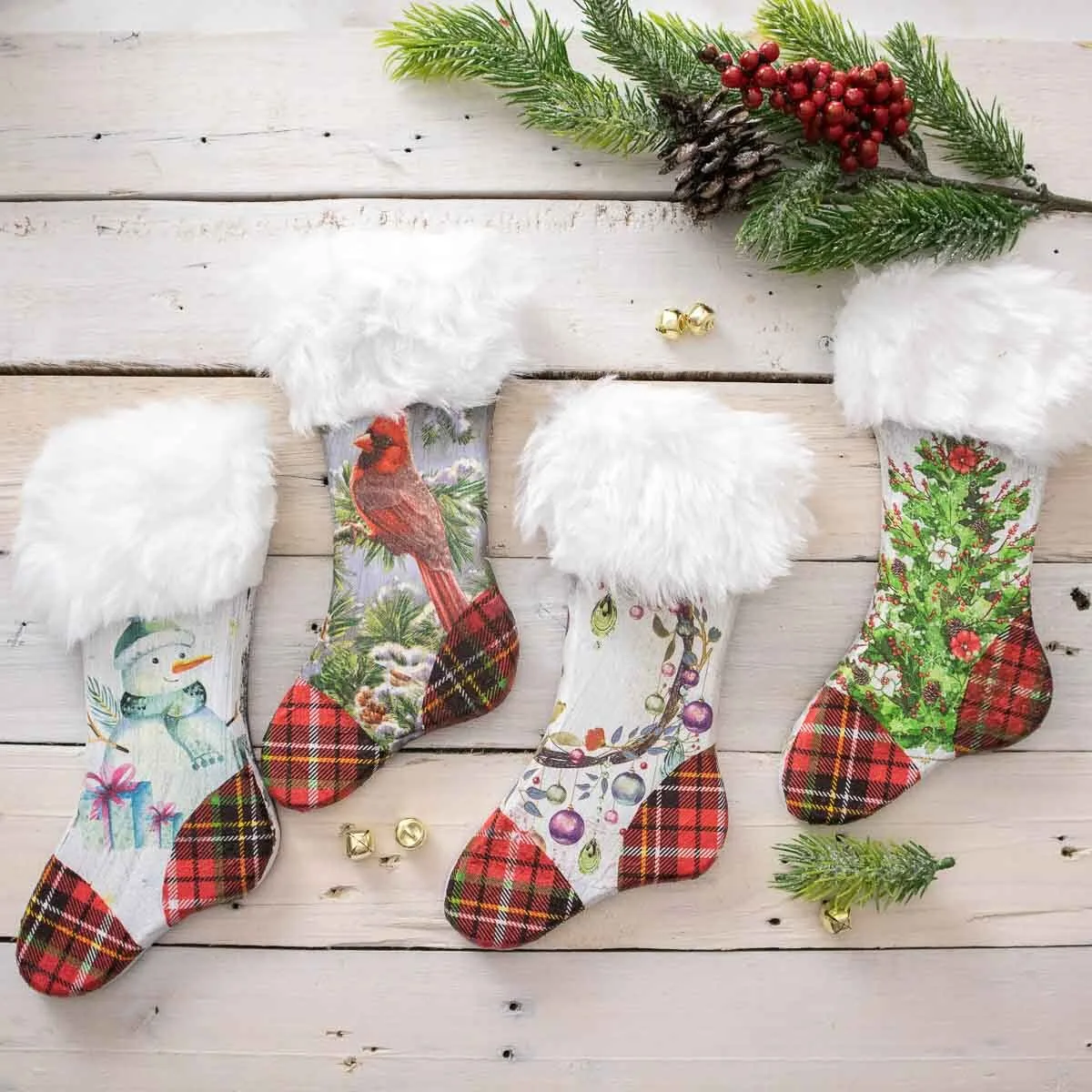 Wooden Christmas stockings decorated with festive napkins and faux fur.