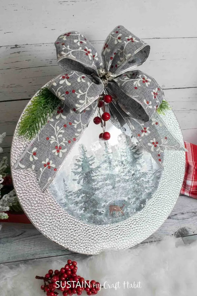 Silver charger Christmas craft made with a plate, napkins and embellishments.
