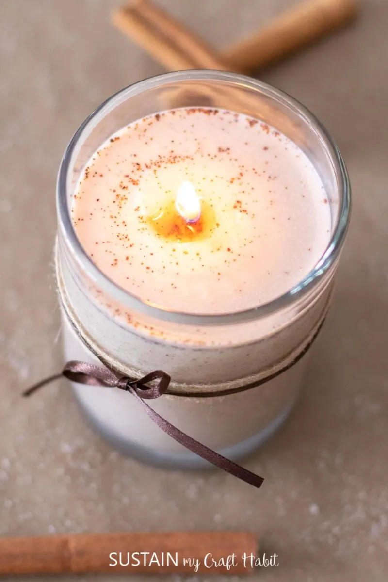 Overhead view of a lit homemade snicker doodle candle.