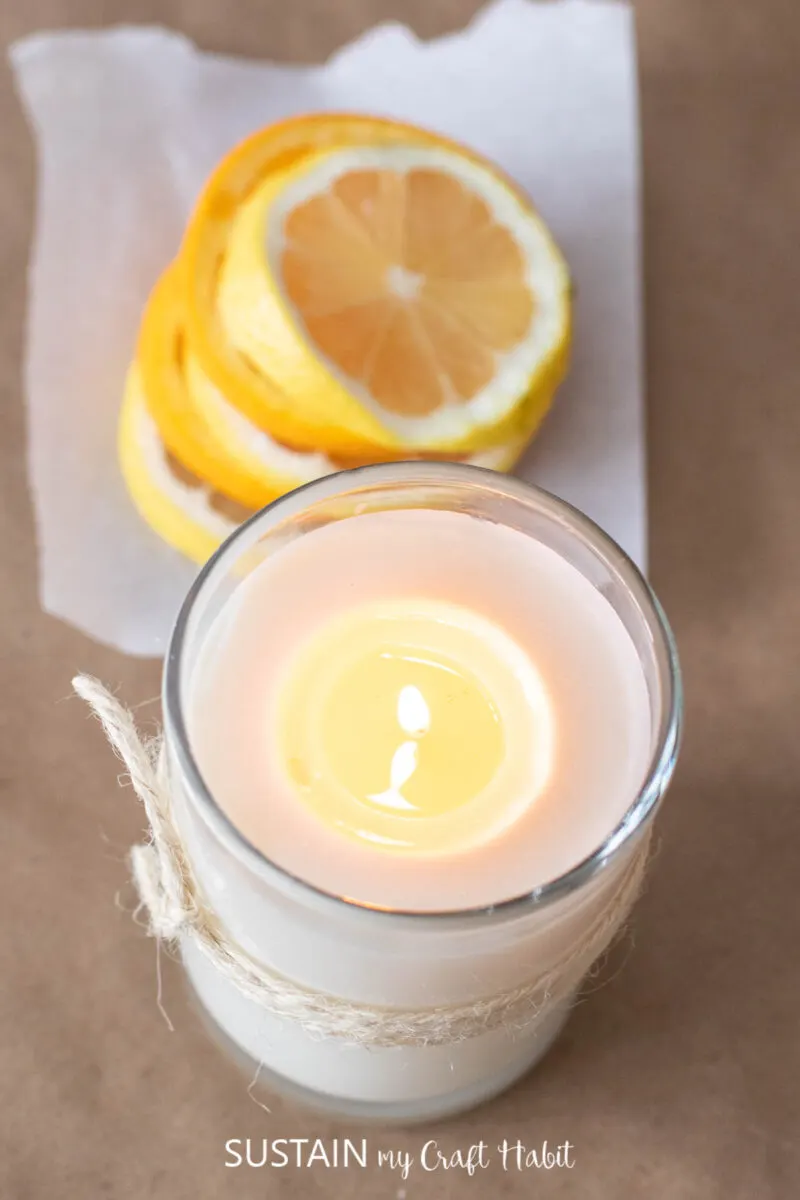 Overhead view of a lit homemade citrus crinkle cookie candle.
