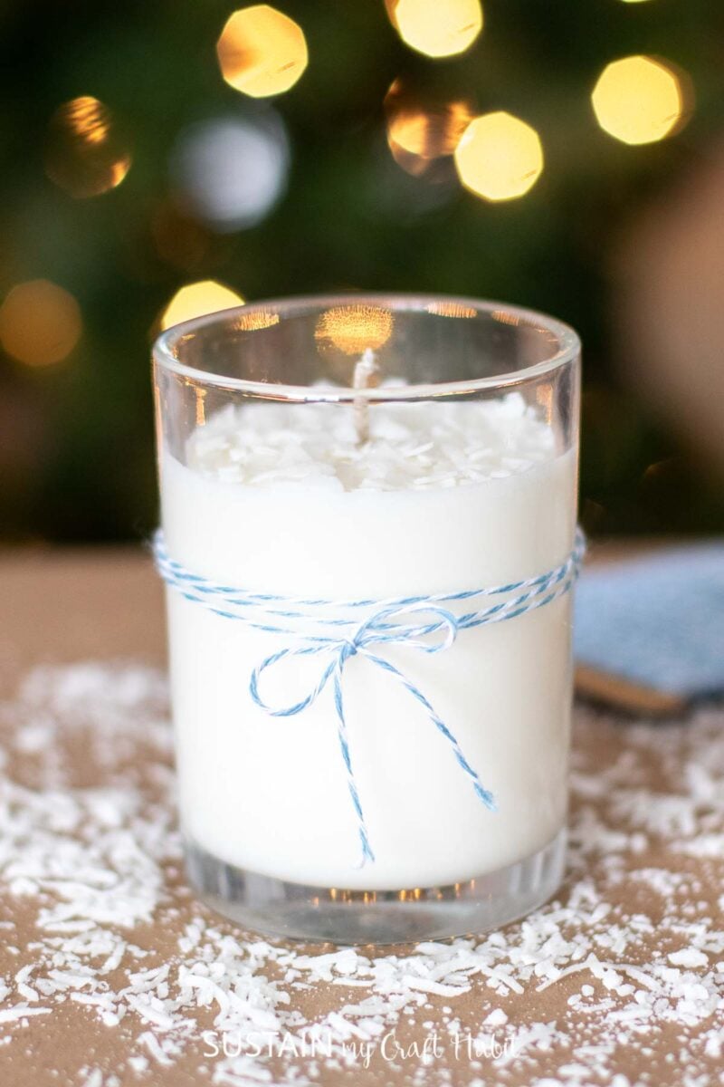 Homemade coconut vanilla shortbread candle wrapped with blue string.