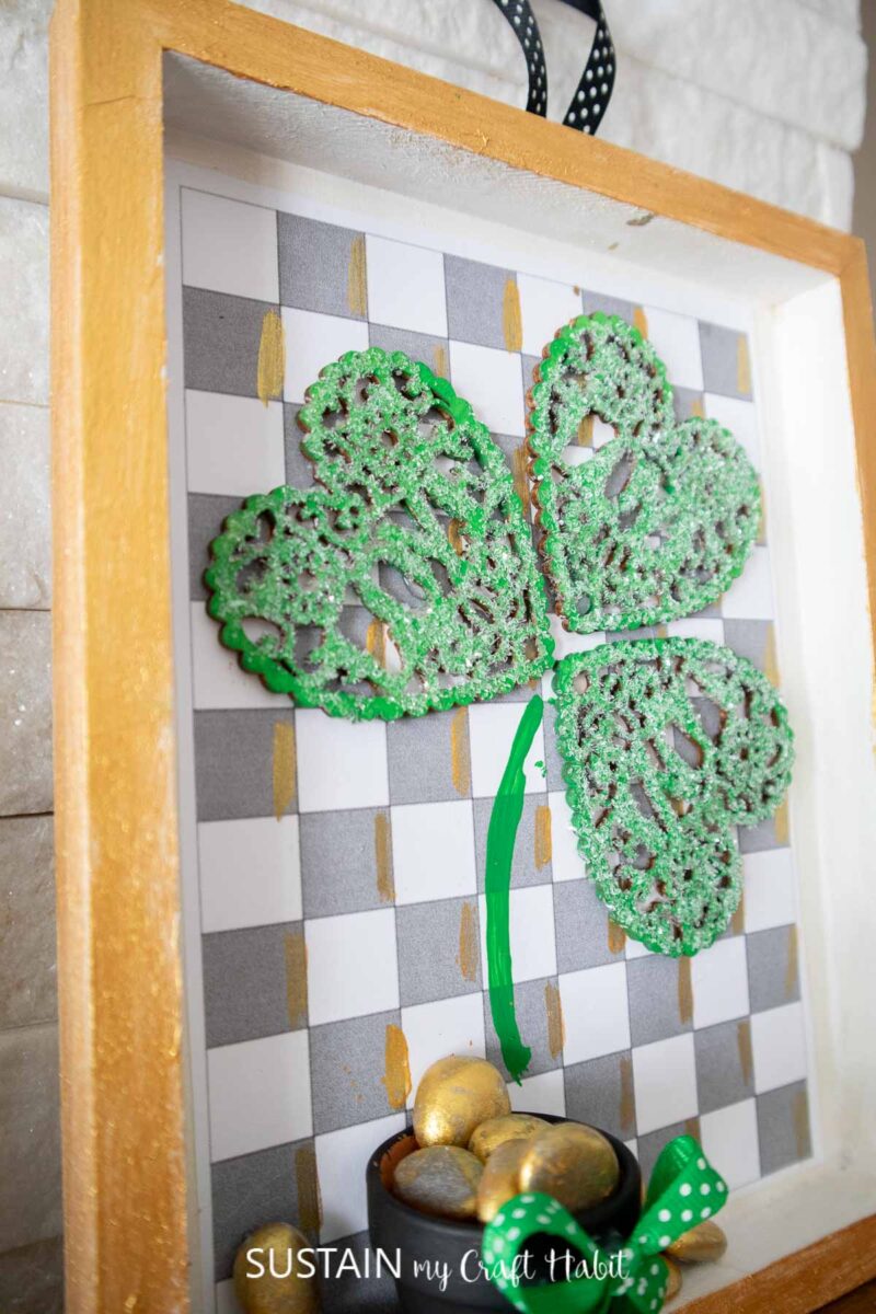 Saint Patrick's day framed craft with a wood hearts shamrock and gold nuggets.
