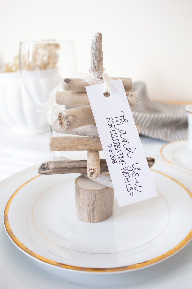 Mini driftwood tree on a plate with a thank you tag attached.