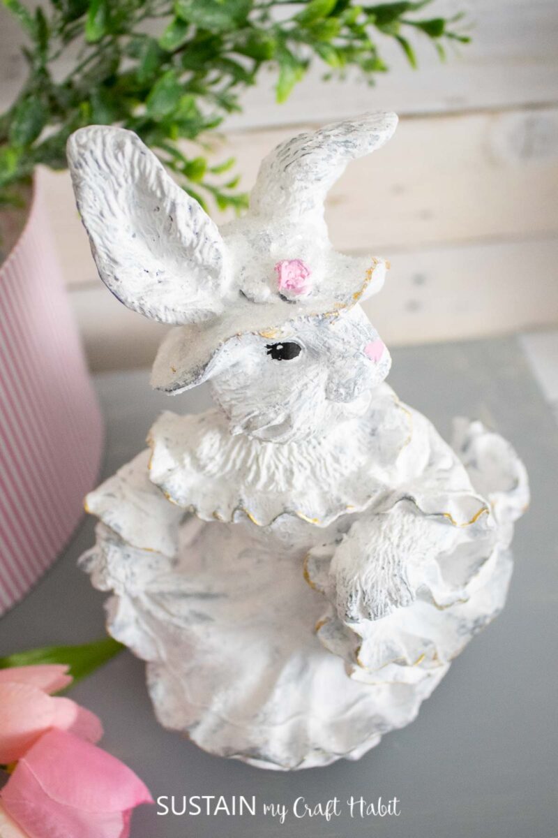 Overhead view of a painted ceramic bunny.