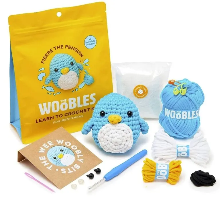 All the craft supplies in a Woobles Crochet kit including yarn, hook, stuffing, eyes and instructions.