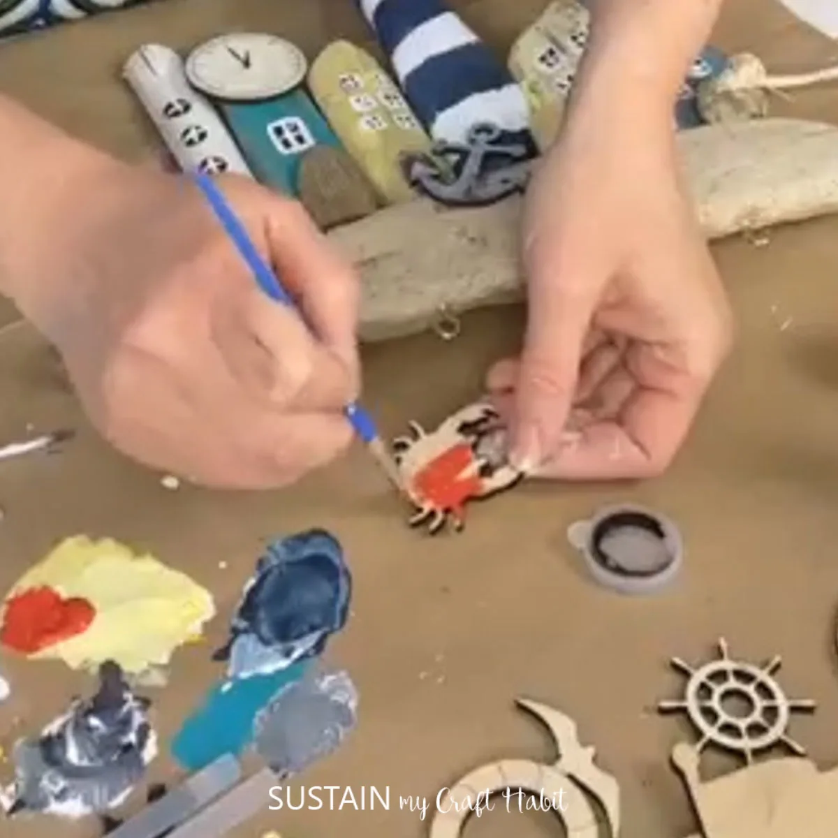 Painting a crab cut out.