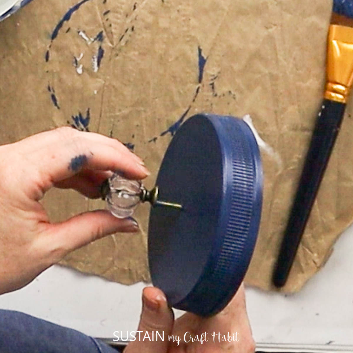 Attaching a knob to a lid.
