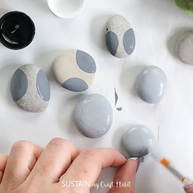 Painting stones grey.