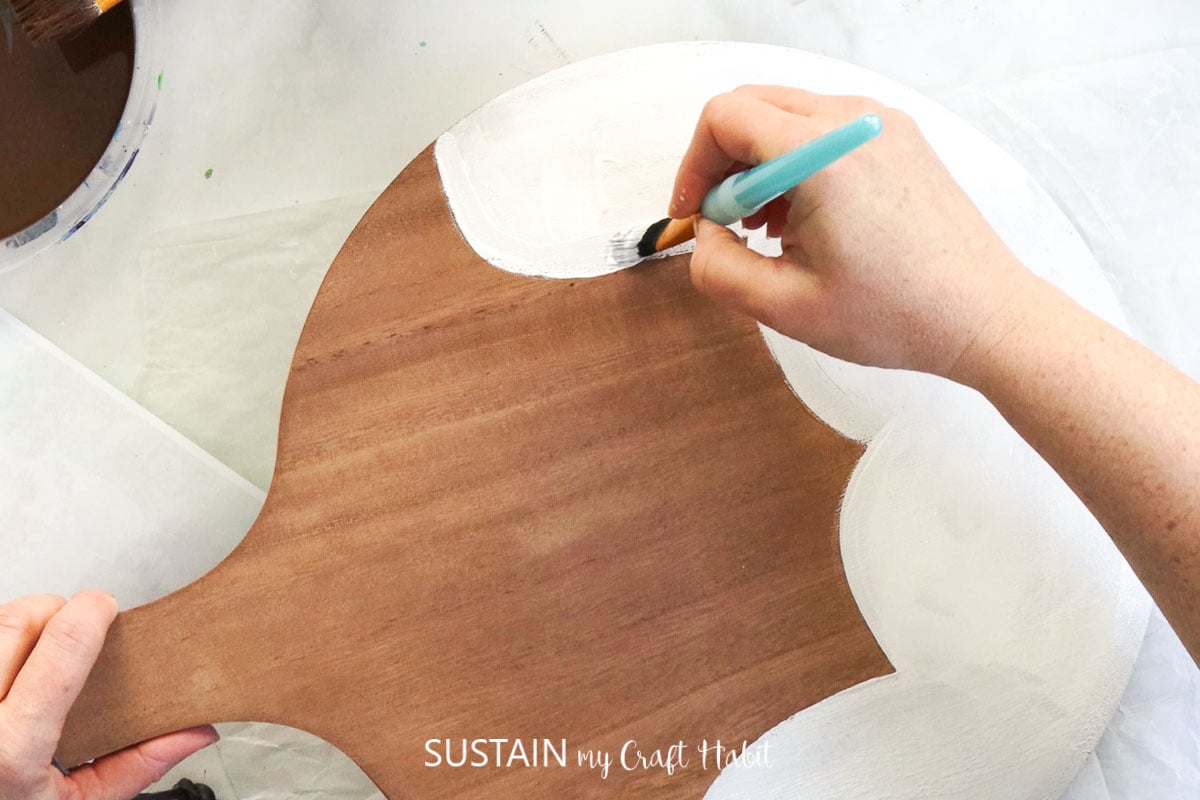 Painting the bottom of the cutting board.