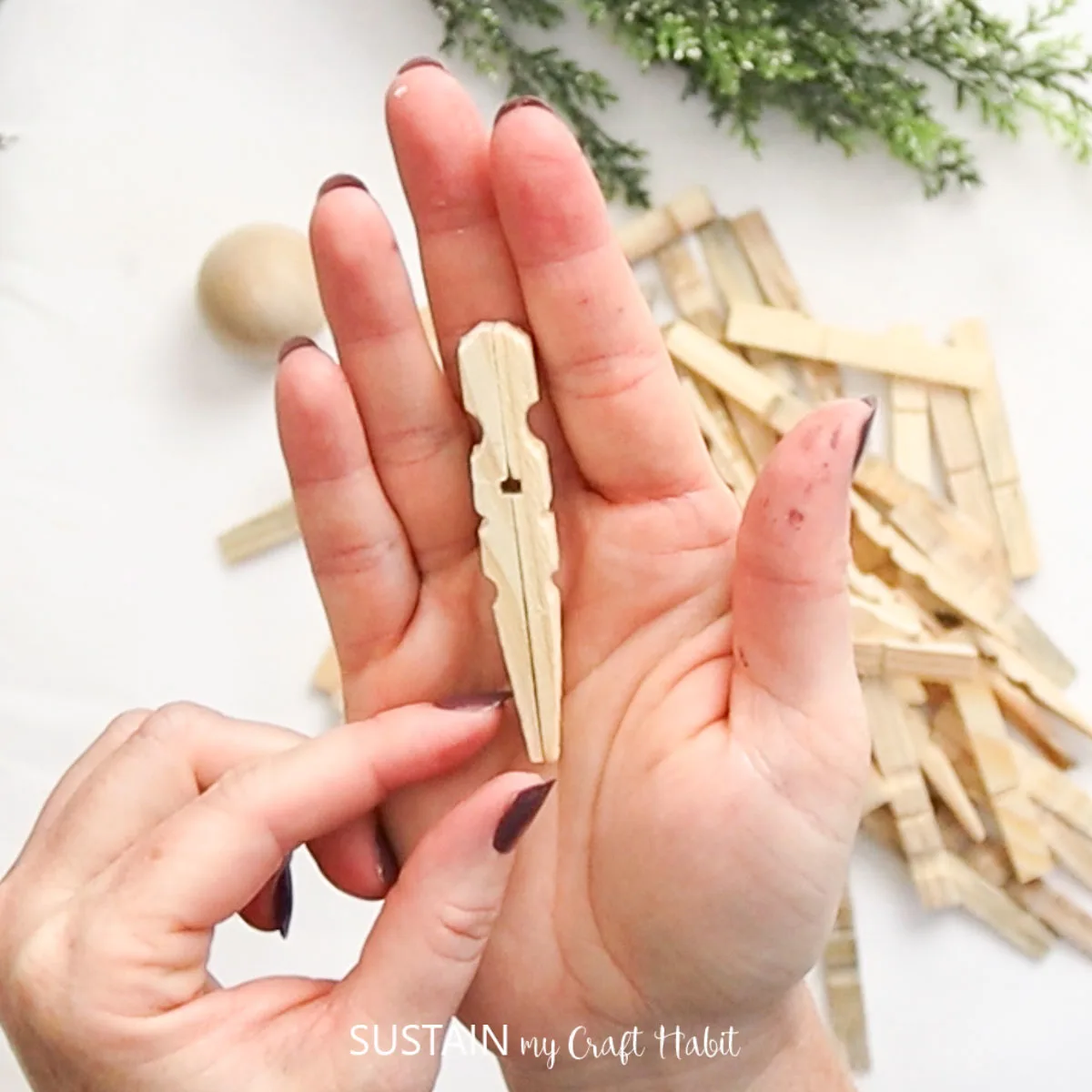 Gluing backs of clothespins together.