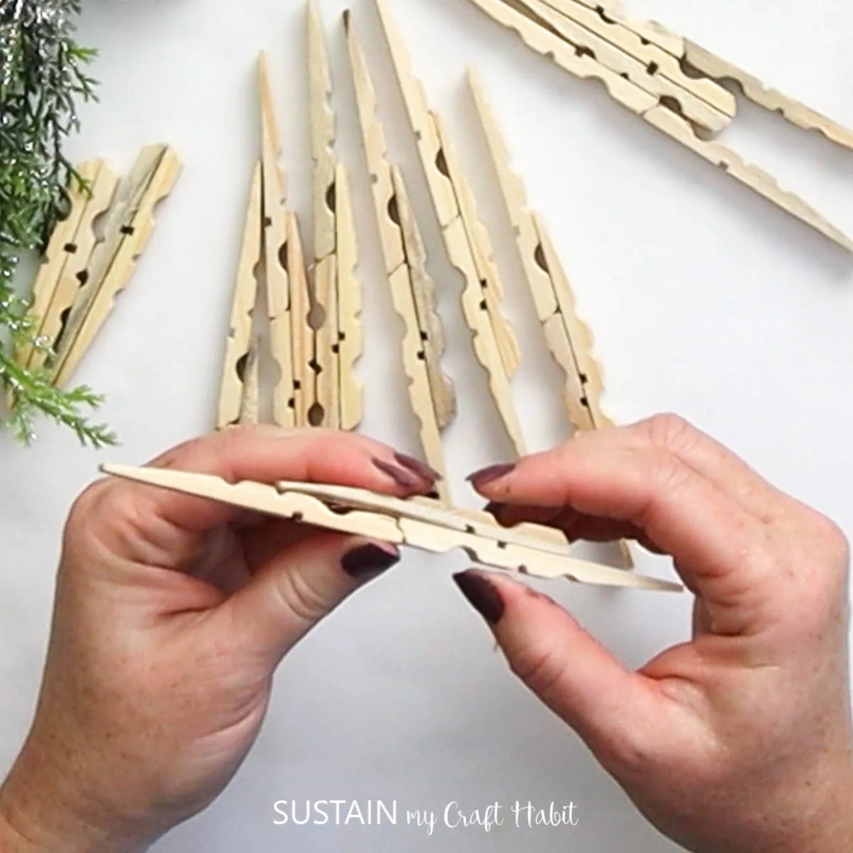Attaching clothespins together.