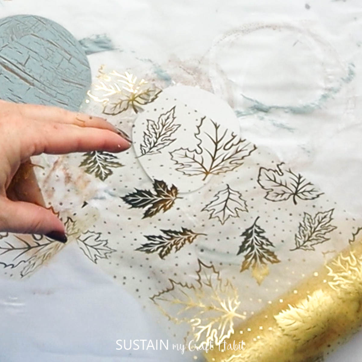 Cutting gold tulle.