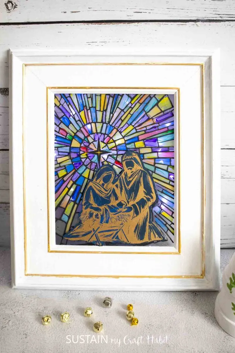 Stained glass Nativity scene in a picture frame.