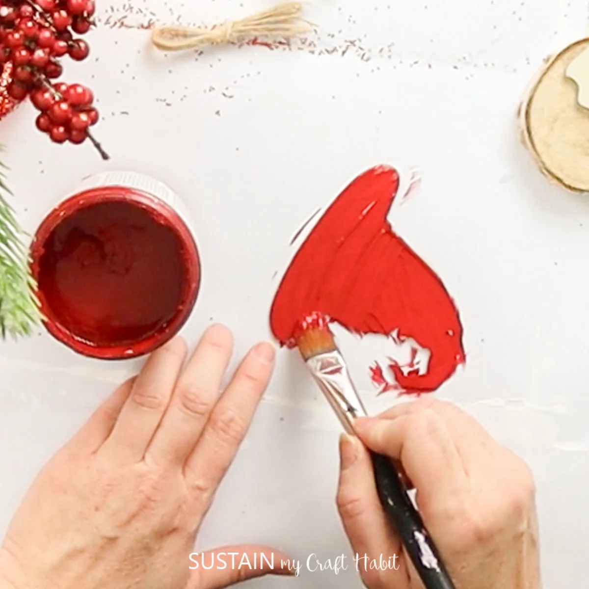 Painting a hat cut out red.
