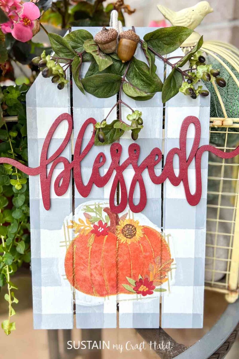 Blessed fall sign decorated with buffalo check paint, pumpkin decoupage and embellishments.