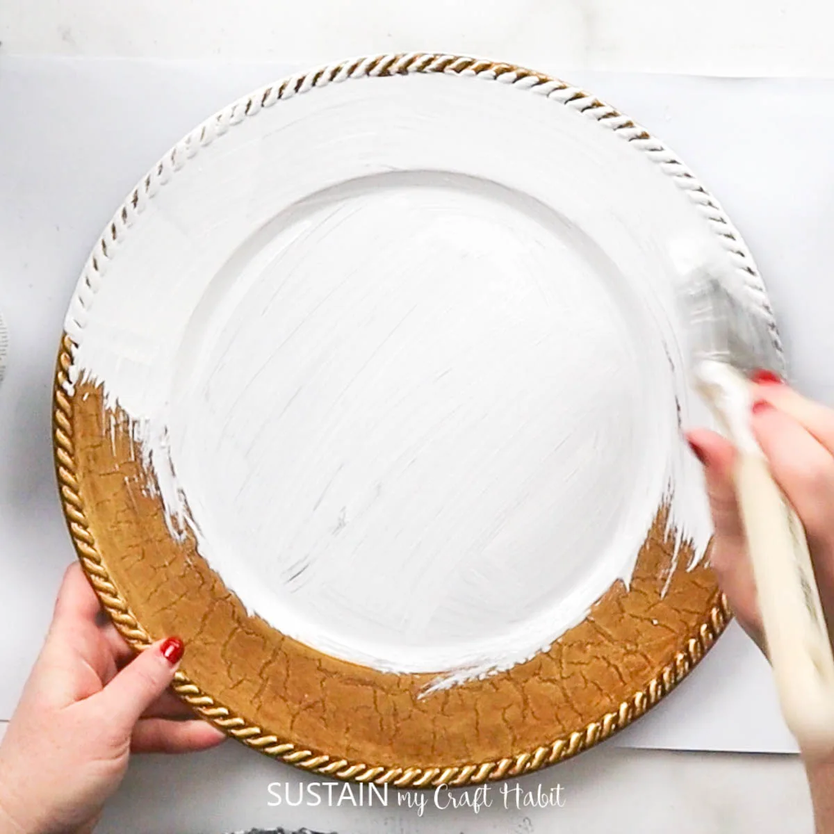Painting a charger plate white.