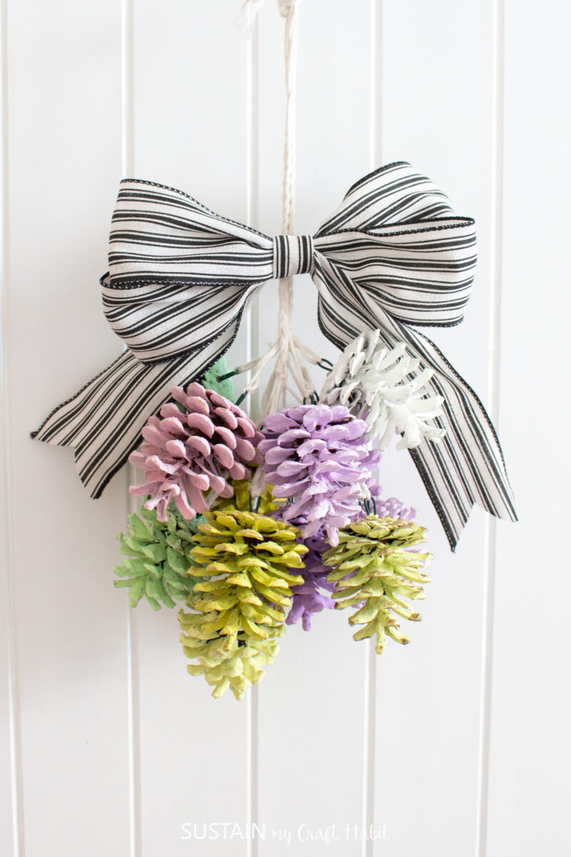 Image showcasing DIY Easter Door Decor with Pinecones