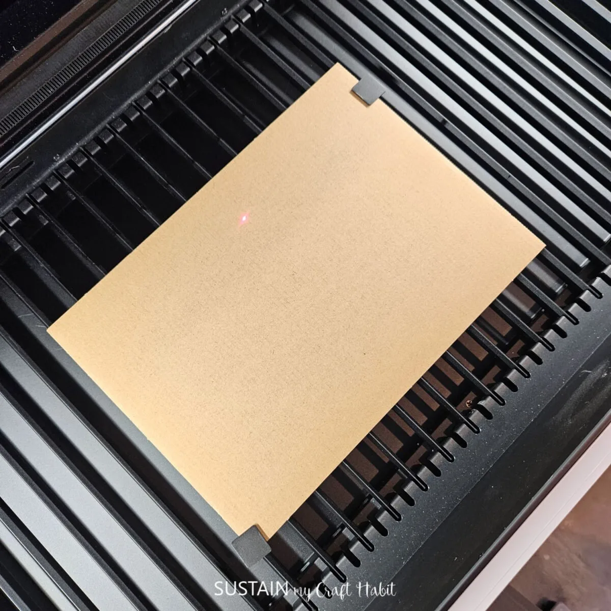 Placing corrugated cardboard into the xtool machine.
