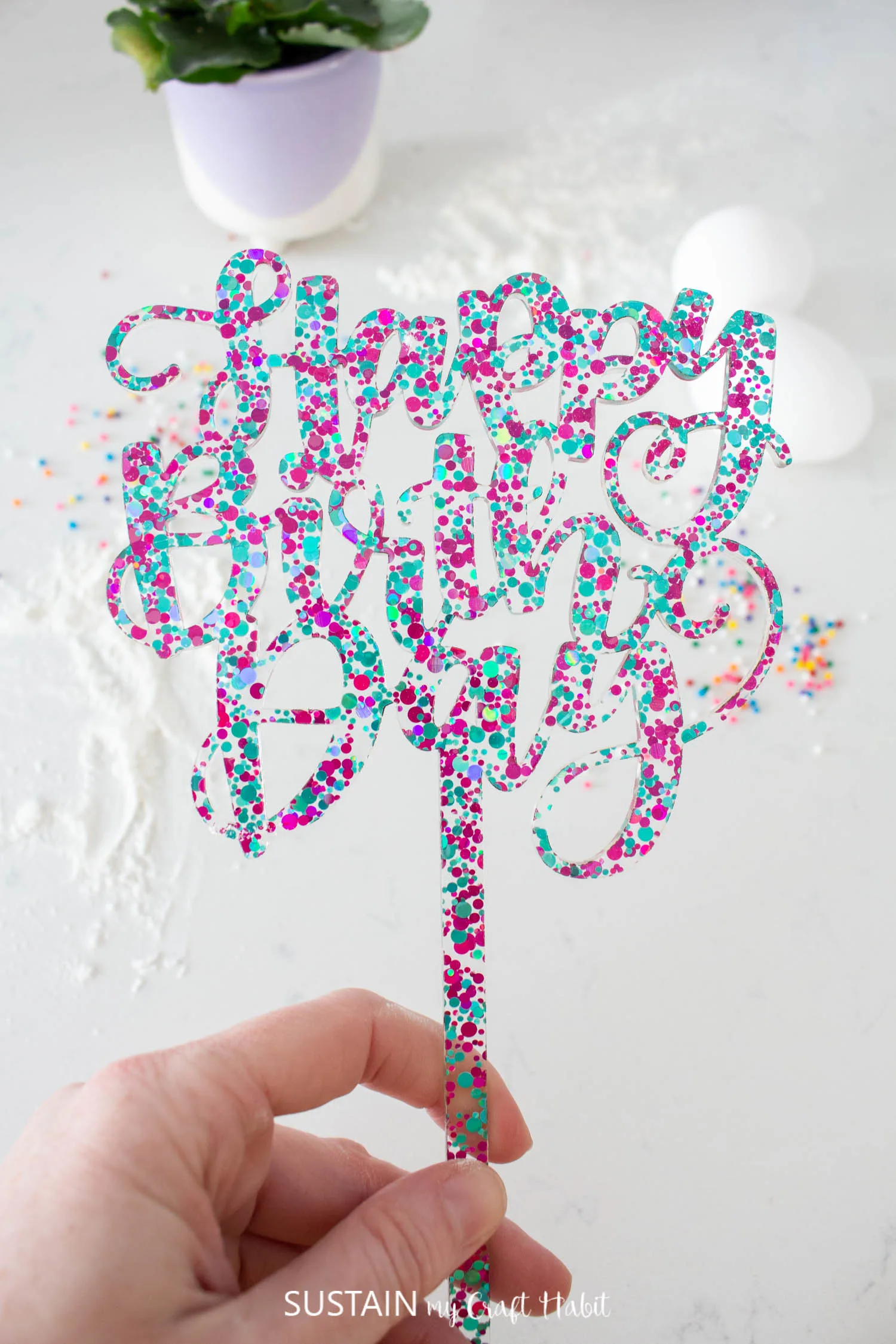 Acrylic cut cake topper.