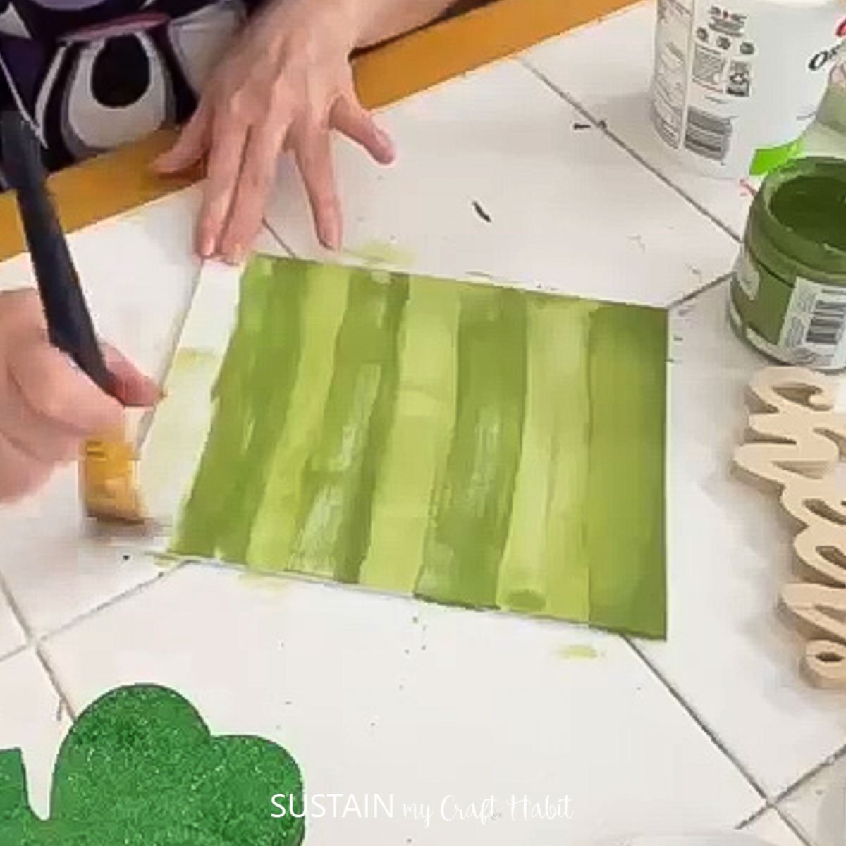 Blending the green paint with water.