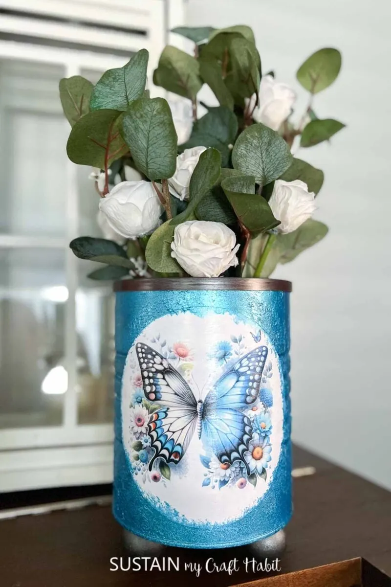 Decorated coffee tin planter.