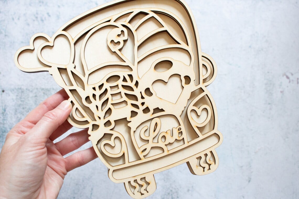 Laser cut wooden gnomes.