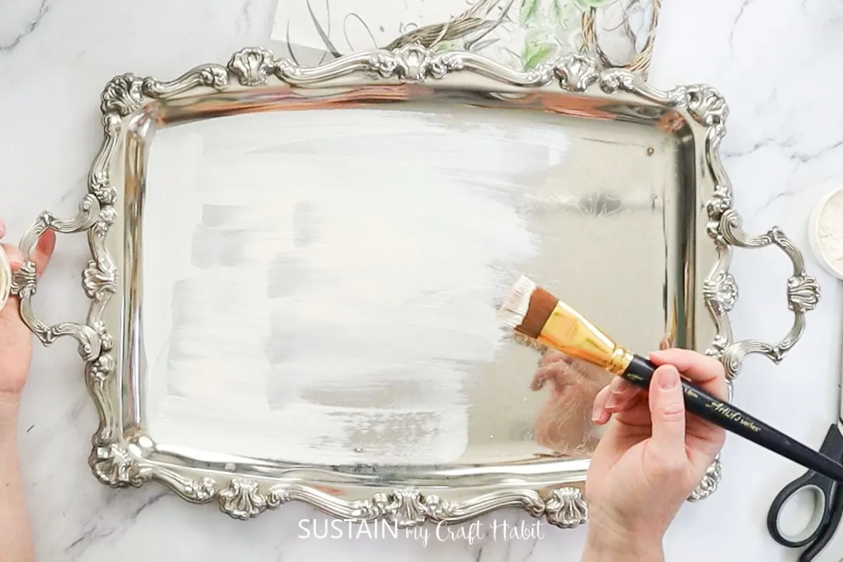 Painting a silver tray white.