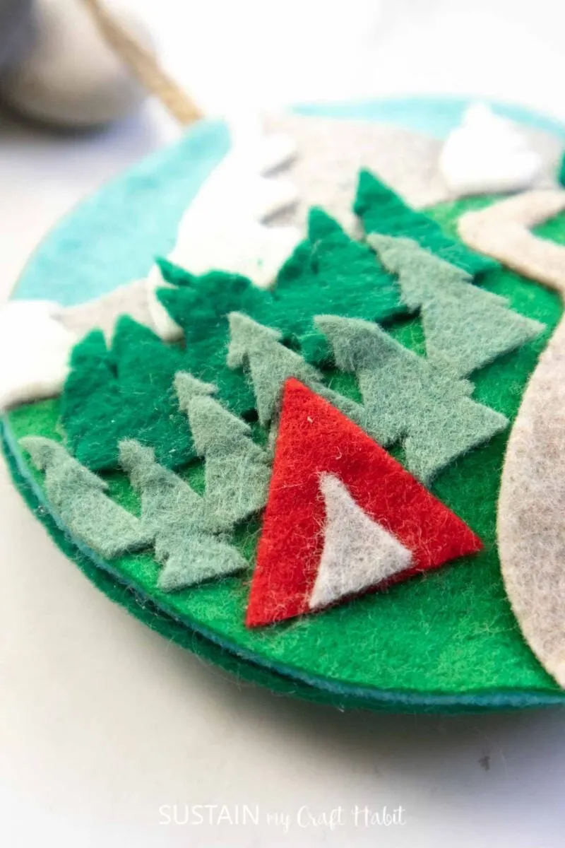 Close of felt tent and trees.