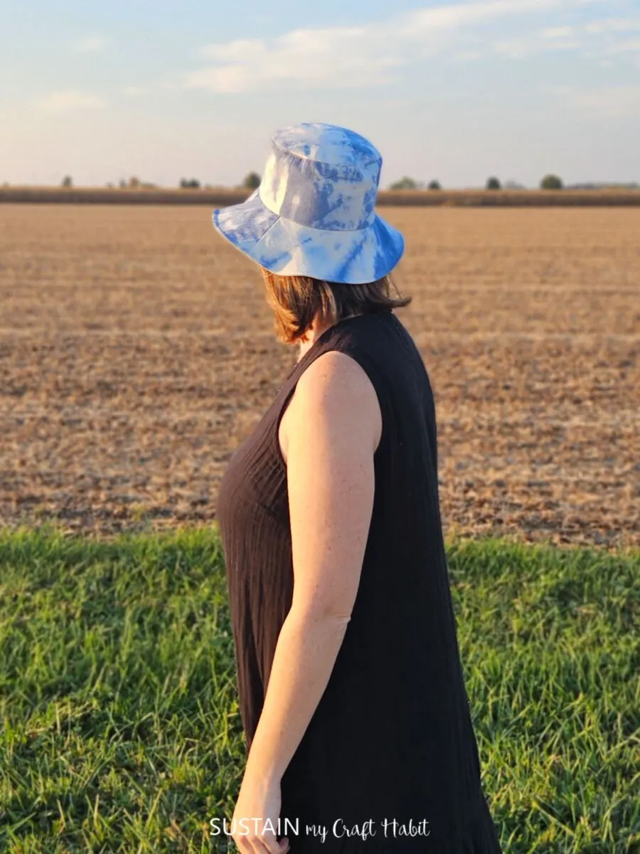 Woman looking away wearing a bucket hat.