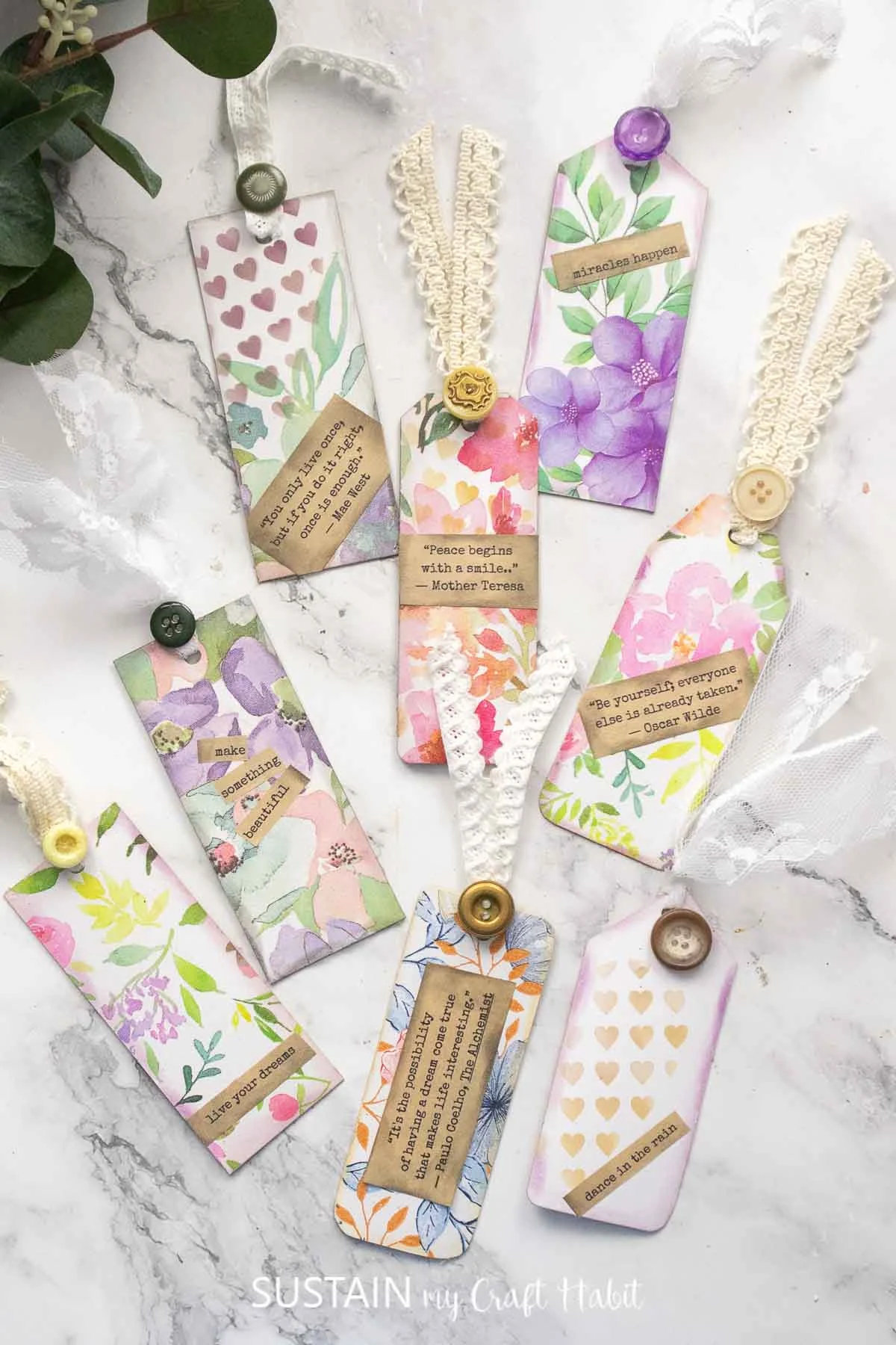 Upcycled cardboard turned into decorative tags with napkins and ribbon.