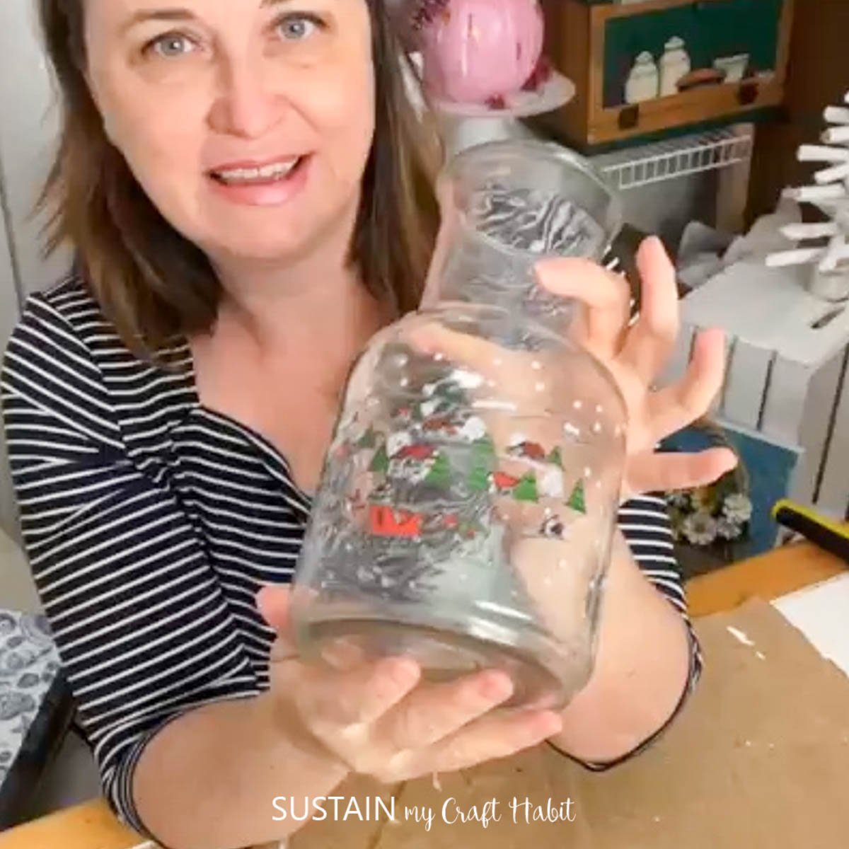 Woman holding a glass jar.