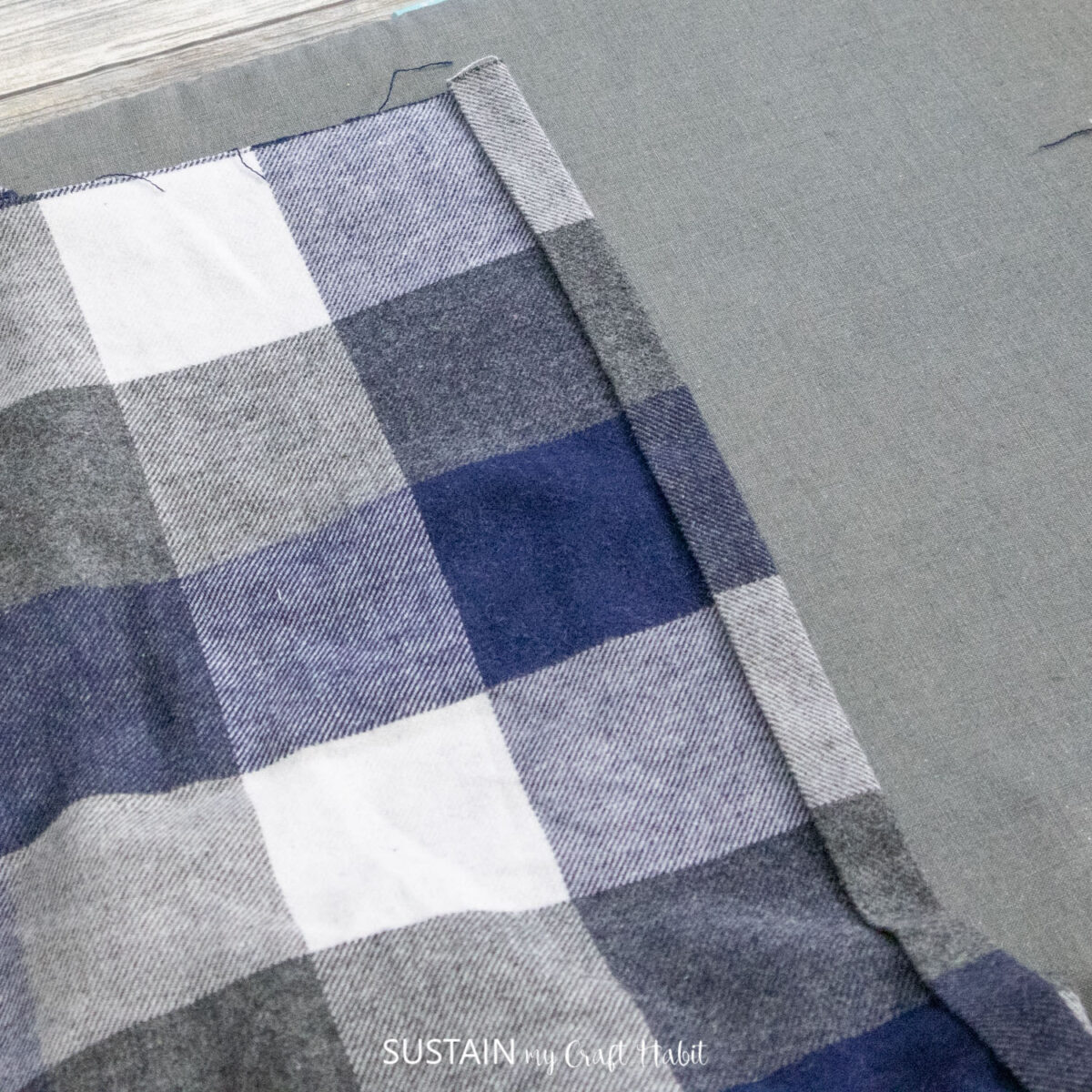 Ironing the sides of the fabric down.