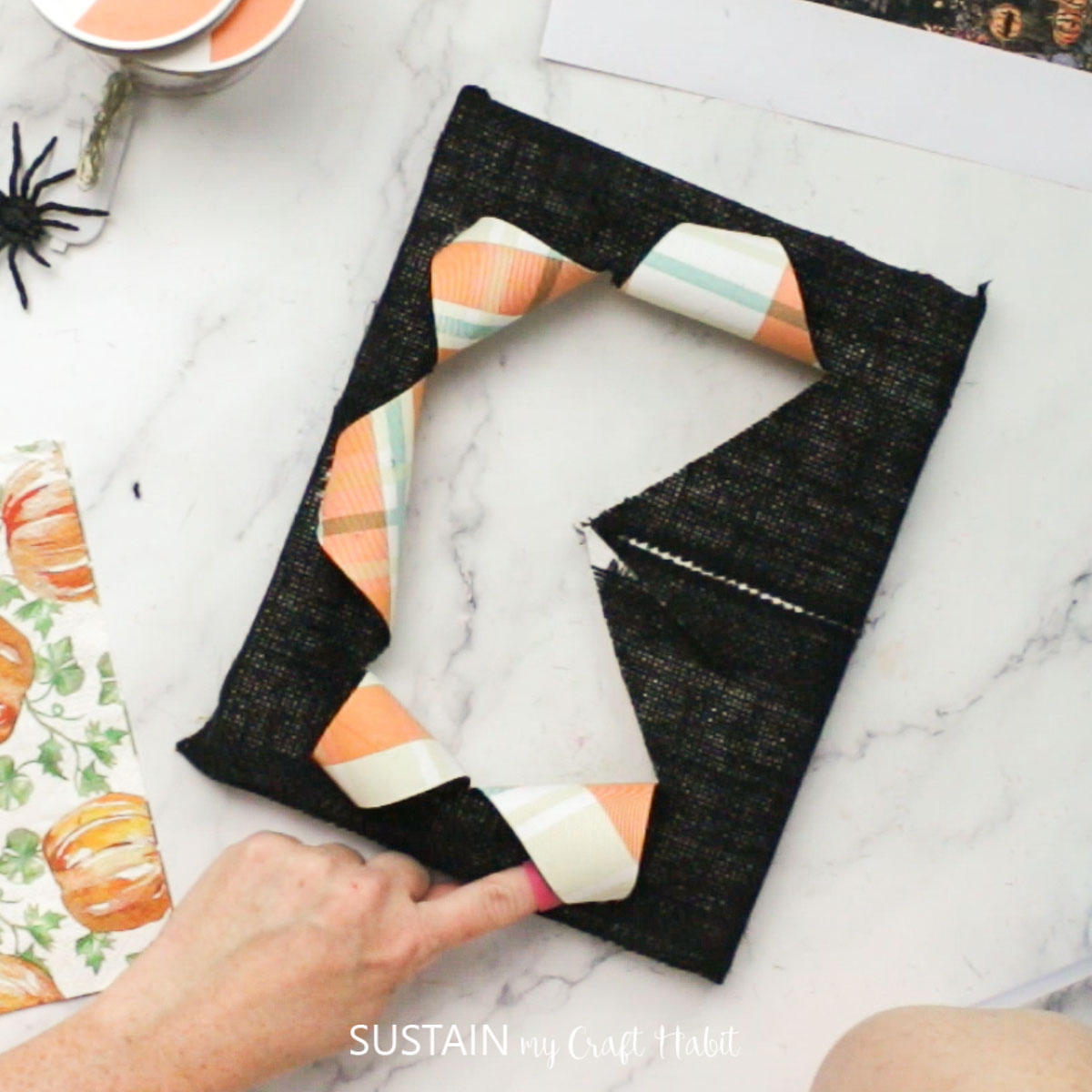 Folding and gluing pieces of canvas. 