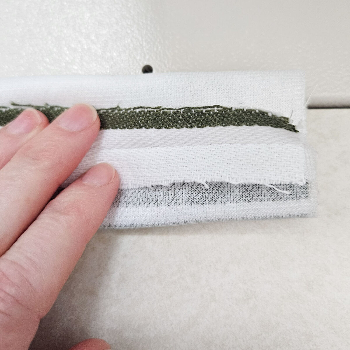 Placing the sewn piece flat.