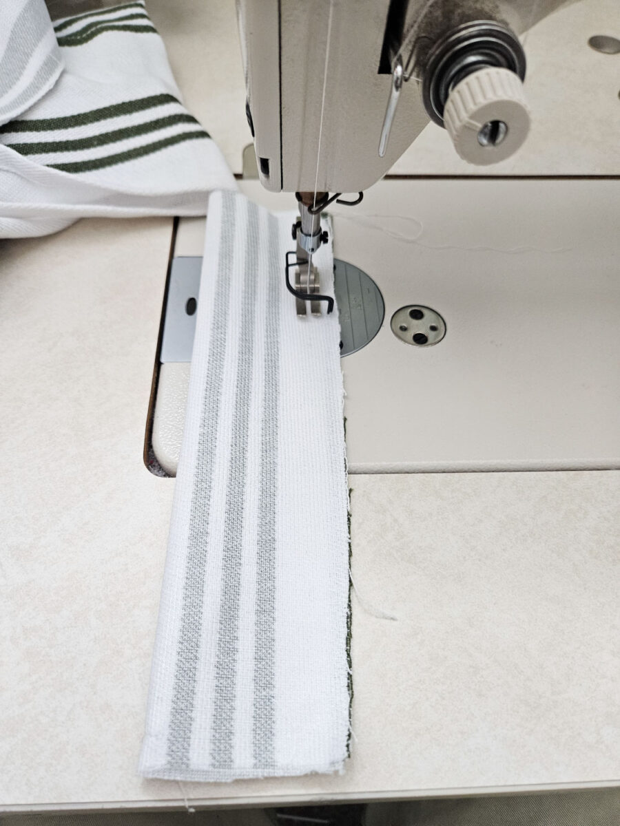 Sewing the seam of the tea towel.
