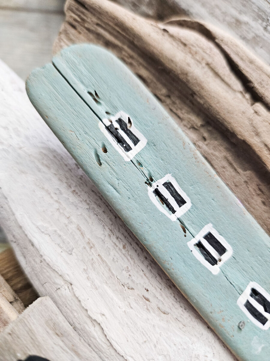 Close up of painted driftwood.