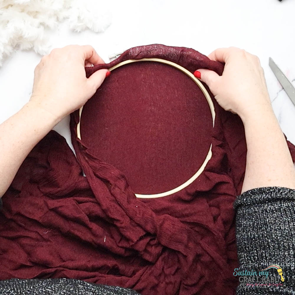 Inserting fabric into an embroidery hoop.