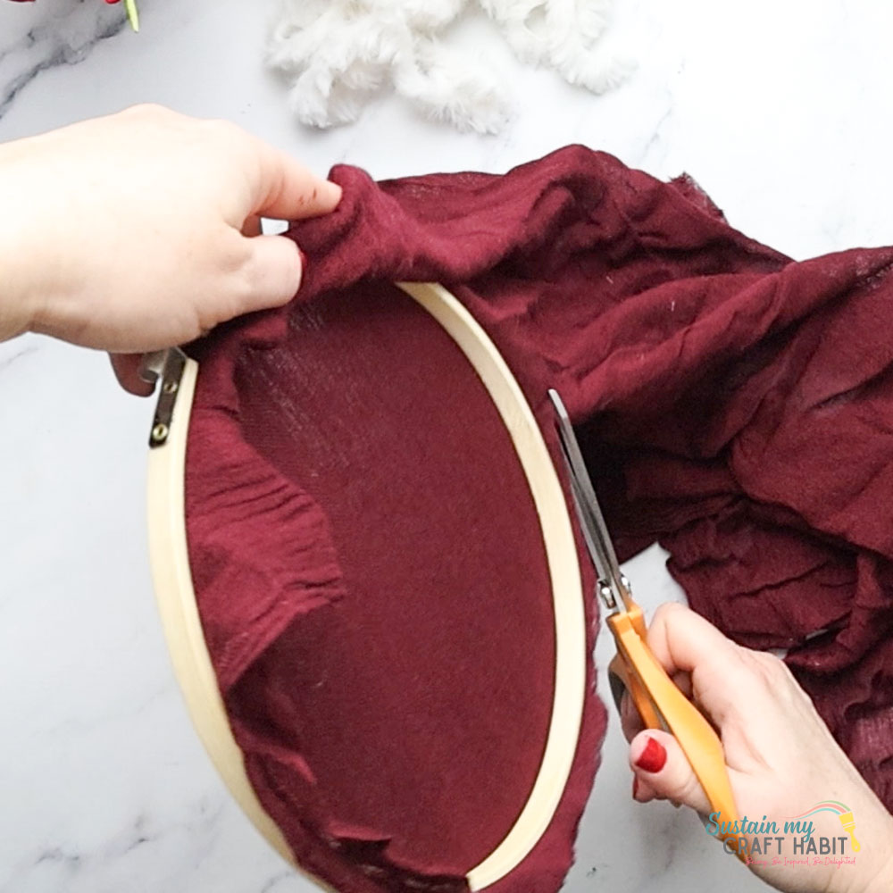 Cutting excess fabric.