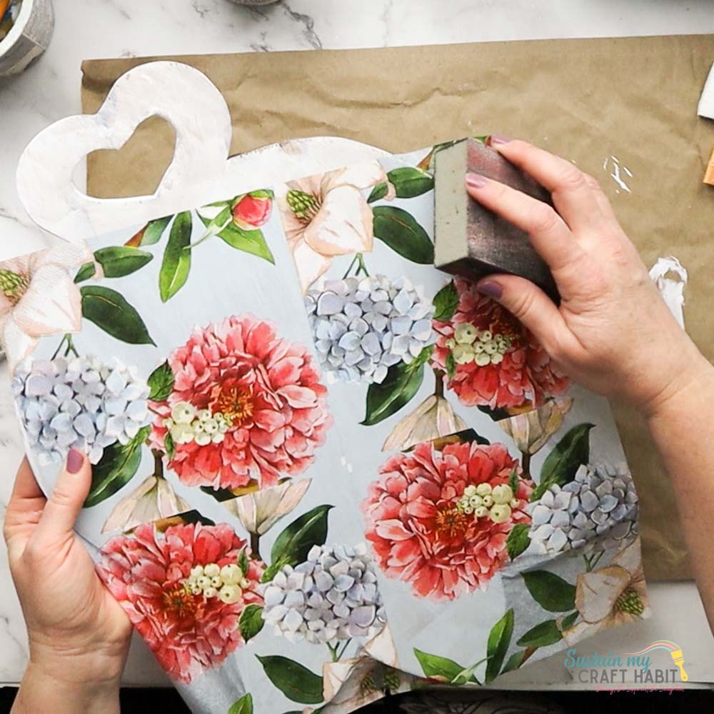 Removing excess napkin from tulip board.