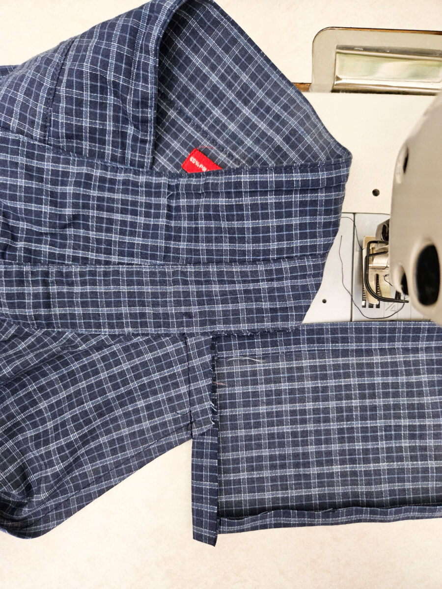 Aligning edges of fabric together.