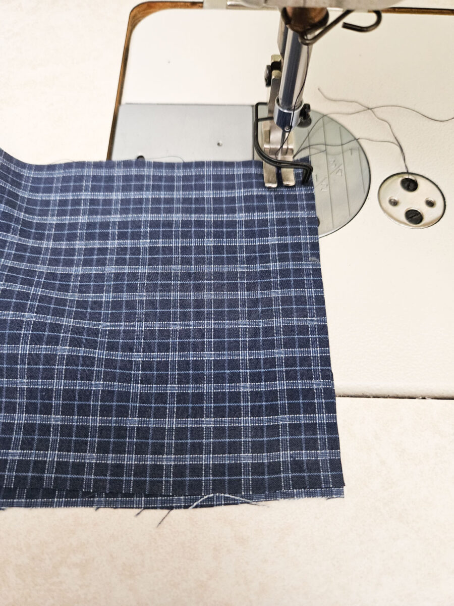 Sewing edges of fabric.
