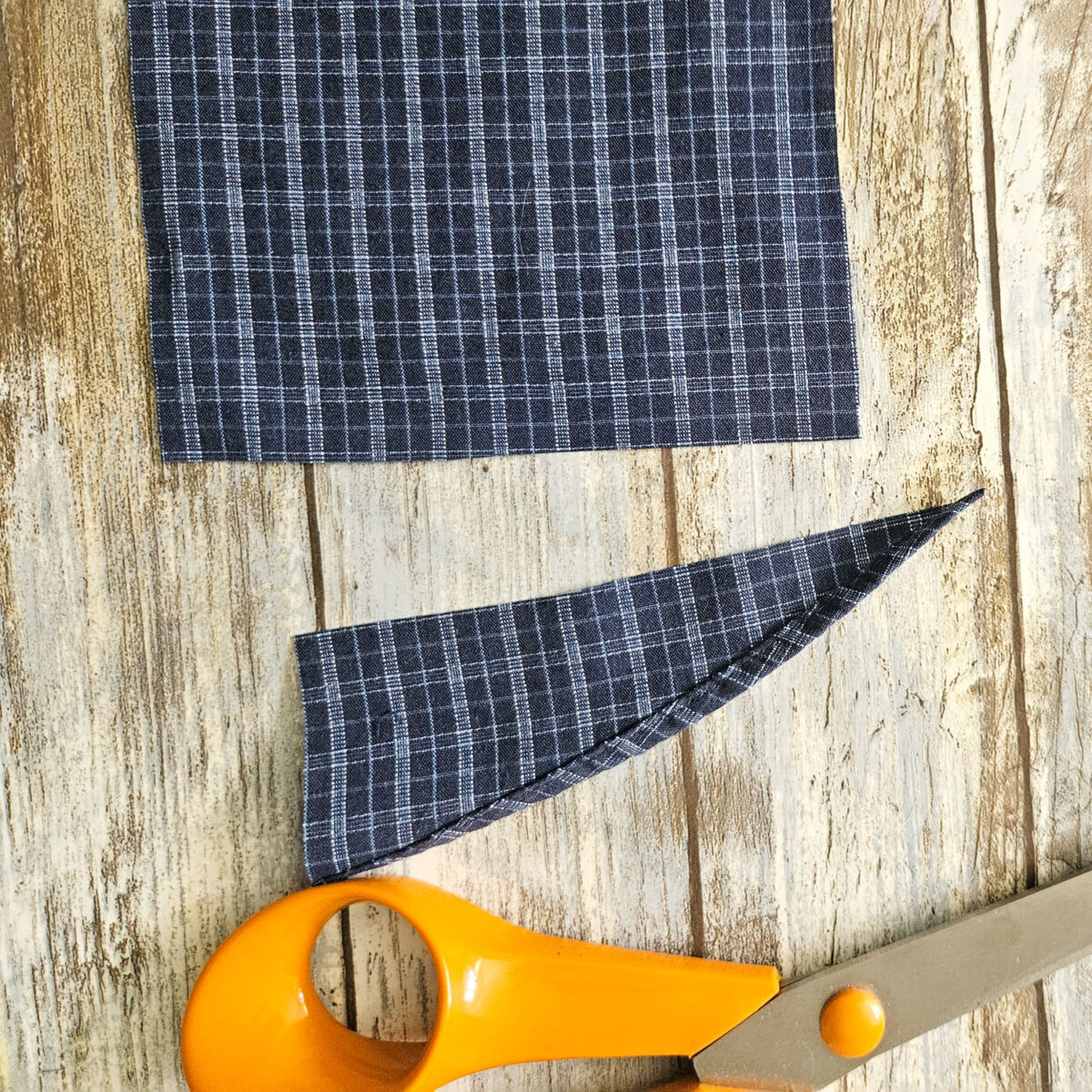 Cutting excess fabric.