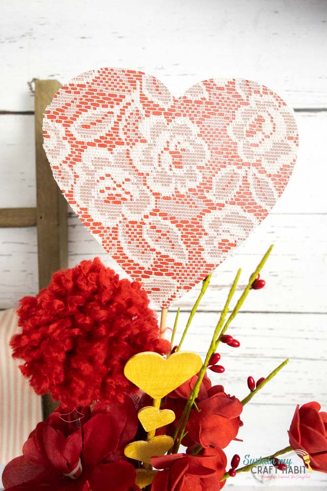 Decorated wood heart centerpiece.