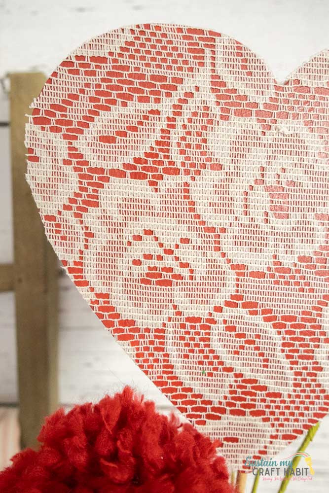 Close up of heart decorated with fabric.