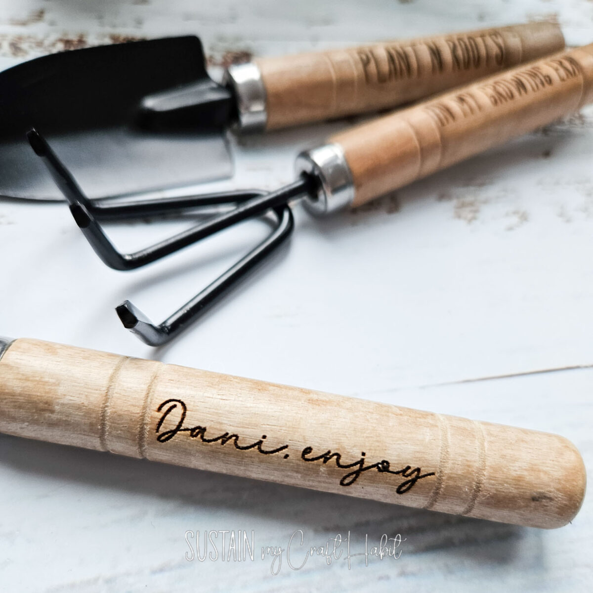 Close up of engraved garden tools with xTool machine.